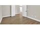 Clean bedroom featuring wood-look vinyl flooring and open doorway at 1225 Stonesthrow Cir, North Las Vegas, NV 89031