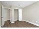 This bedroom has wood-look floors and a closet for storage at 1225 Stonesthrow Cir, North Las Vegas, NV 89031