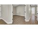 Neutral bedroom featuring wood-look vinyl flooring and white trim at 1225 Stonesthrow Cir, North Las Vegas, NV 89031