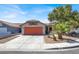 Charming single-story home with a desert-landscaped front yard and an attached two-car garage at 1225 Stonesthrow Cir, North Las Vegas, NV 89031