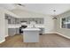 Stylish kitchen featuring gray cabinets, quartz countertops, and stainless steel appliances at 1225 Stonesthrow Cir, North Las Vegas, NV 89031