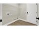 Laundry room with washer hookups, wire shelving, and a door at 1225 Stonesthrow Cir, North Las Vegas, NV 89031