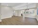 Spacious living area with light wood floors, neutral walls, and an open layout at 1225 Stonesthrow Cir, North Las Vegas, NV 89031