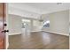Bright and spacious living room with wood-look floors and modern lighting fixtures at 1225 Stonesthrow Cir, North Las Vegas, NV 89031