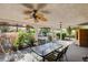Covered patio with a ceiling fan and dining table, perfect for outdoor entertaining at 1333 Date Palm Cir, Las Vegas, NV 89108