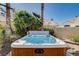 This relaxing hot tub features a wooden frame and soothing blue interior and is ready for your enjoyment at 1333 Date Palm Cir, Las Vegas, NV 89108