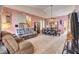 Open-concept living room and dining area with plush furniture and ample natural light at 1333 Date Palm Cir, Las Vegas, NV 89108
