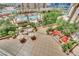 Expansive view showcasing a pool, patio furniture, and manicured landscaping from above at 135 E Harmon Ave # 315, Las Vegas, NV 89109