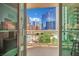 Enjoy city views from the balcony overlooking a pool and modern architecture at 135 E Harmon Ave # 315, Las Vegas, NV 89109