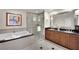 This luxurious bathroom offers a glass-enclosed shower, a soaking tub, and a double vanity with elegant fixtures at 135 E Harmon Ave # 315, Las Vegas, NV 89109