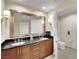 Bathroom with a spacious double vanity, modern lighting, and a separate toilet area, offering comfort and convenience at 135 E Harmon Ave # 315, Las Vegas, NV 89109