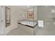 A modern bathroom features a relaxing soaking tub and a separate glass-enclosed shower, perfect for unwinding at 135 E Harmon Ave # 315, Las Vegas, NV 89109