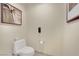 Cozy bathroom featuring a toilet, telephone, and minimalist decor at 135 E Harmon Ave # 315, Las Vegas, NV 89109