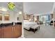 This stylish bedroom boasts a comfortable bed, seating area, and cityscape views, perfect for relaxation and enjoying the city at 135 E Harmon Ave # 315, Las Vegas, NV 89109