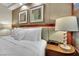 Comfortable bedroom with a plush bed, soft pillows, and stylish bedside lamps at 135 E Harmon Ave # 315, Las Vegas, NV 89109