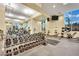 Spacious gym with weights, machines, mirrors, and natural light, perfect for a comprehensive fitness routine at 135 E Harmon Ave # 315, Las Vegas, NV 89109