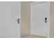 Hallway showing two unit doors, one labeled 