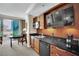 This kitchenette is equipped with modern appliances and overlooks a dining area and a stunning city view at 135 E Harmon Ave # 315, Las Vegas, NV 89109