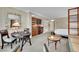 Open living space featuring a kitchenette, bedroom area, and dining table with chairs at 135 E Harmon Ave # 315, Las Vegas, NV 89109