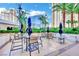 Inviting outdoor patio with tables and chairs, perfect for relaxing and enjoying the surrounding city views at 135 E Harmon Ave # 315, Las Vegas, NV 89109