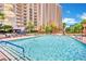 A large, inviting pool with lounge chairs and umbrellas, perfect for relaxation at 135 E Harmon Ave # 315, Las Vegas, NV 89109