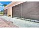 Modern water feature with a wall of cascading water and lush landscaping at 135 E Harmon Ave # 315, Las Vegas, NV 89109