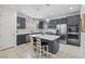 Modern kitchen featuring gray cabinets, stainless steel appliances, a quartz island, and pendant lighting at 160 Lilt Ave, Henderson, NV 89011