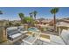Comfortable balcony seating with a view of the community pool and desert landscaping at 1701 Drifters Peak St, Las Vegas, NV 89144