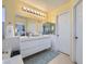 Bright bathroom with double vanity, soaking tub, and separate shower at 1701 Drifters Peak St, Las Vegas, NV 89144