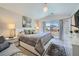 Serene bedroom with sliding glass doors to the yard and a plush, inviting bed at 1701 Drifters Peak St, Las Vegas, NV 89144