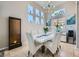 Dining area featuring natural light, elegant decor, and modern furniture at 1701 Drifters Peak St, Las Vegas, NV 89144