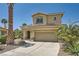 Charming two-story home with a well-manicured front yard and desert landscaping at 1701 Drifters Peak St, Las Vegas, NV 89144