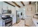 Beautifully updated kitchen with sleek appliances, bright countertops, and ample cabinet space at 1701 Drifters Peak St, Las Vegas, NV 89144