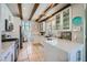 Bright, eat-in kitchen features white cabinetry, quartz counters, and modern appliances at 1701 Drifters Peak St, Las Vegas, NV 89144