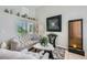Living room featuring natural light, sleek furniture, and modern decor at 1701 Drifters Peak St, Las Vegas, NV 89144