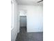 Neutral bedroom featuring soft gray carpet, and a walk-in closet with ample storage at 1703 Game Garden Rd, North Las Vegas, NV 89031