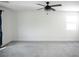 Bedroom showcasing plush carpet, white walls, and a modern ceiling fan at 1703 Game Garden Rd, North Las Vegas, NV 89031