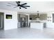 Modern open-concept kitchen featuring gray cabinets, a kitchen island, and sleek stainless steel appliances at 1703 Game Garden Rd, North Las Vegas, NV 89031