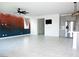 Spacious living room with tile floors, modern fixtures, and an open layout for easy entertaining at 1703 Game Garden Rd, North Las Vegas, NV 89031