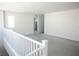 Spacious living area with neutral walls, gray carpet, and natural light streaming in through the window at 1703 Game Garden Rd, North Las Vegas, NV 89031