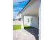 View of covered patio, featuring artificial grass, and block wall fencing at 1703 Game Garden Rd, North Las Vegas, NV 89031