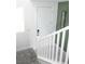 Bright staircase featuring white railings and a clean design with an open view at 1703 Game Garden Rd, North Las Vegas, NV 89031