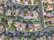 Aerial view of backyard pools along a cul-de-sac street in a meticulously landscaped community at 1717 Double Arch Ct, Las Vegas, NV 89128