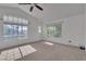 Bright bedroom with large windows offering ample natural light and ceiling fan at 1717 Double Arch Ct, Las Vegas, NV 89128