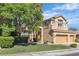 Charming two-story home with landscaped yard and a three-car garage at 1717 Double Arch Ct, Las Vegas, NV 89128
