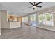 Spacious living room with wood floors, recessed lighting, ceiling fan, and views of the pool at 1717 Double Arch Ct, Las Vegas, NV 89128