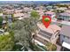 Aerial view highlighting the property's layout, solar panels, pool, mature trees, and desert landscaping at 209 Prairie Creek St, Henderson, NV 89012