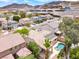 Picturesque desert neighborhood showing the home, pool, covered patio, and surrounding landscape, with mountain views at 209 Prairie Creek St, Henderson, NV 89012