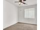 Spacious bedroom featuring carpet, a ceiling fan, and a window providing natural light at 209 Prairie Creek St, Henderson, NV 89012