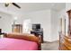 Bedroom with a king bed, white walls and dark wood furniture at 209 Prairie Creek St, Henderson, NV 89012